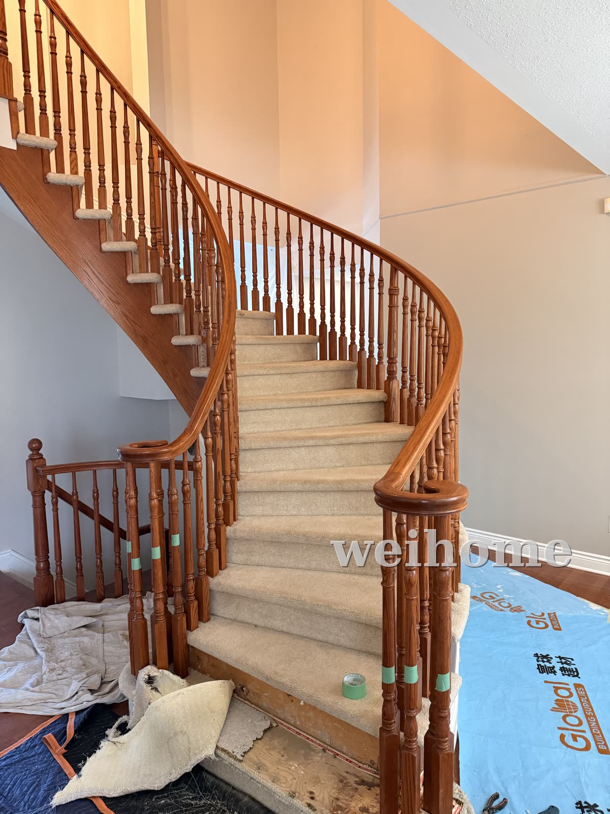 Curved staircase before — carpeted treads