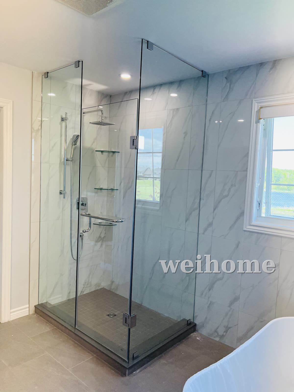 Frameless glass shower with chrome hardware